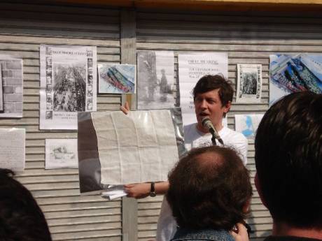 Speaker holding the actual flag that was used to call the surrender from no 16, Moore Street.