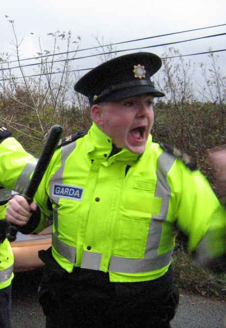 Click on image to see full-sized version Irish police officer during an attack on peaceful protest against Shell refinery construction