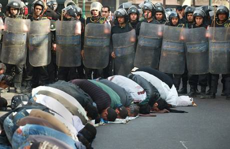 Egyptians pray before day of rage which left more than 50 dead