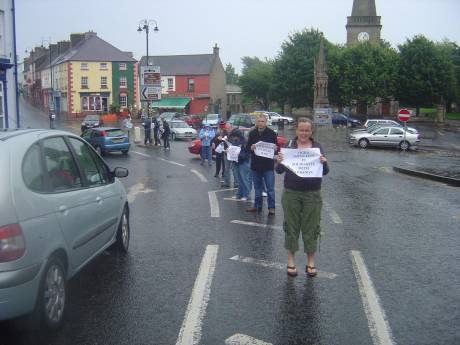 Click on image to see full-sized version Activists brave the rain to show solidarity!