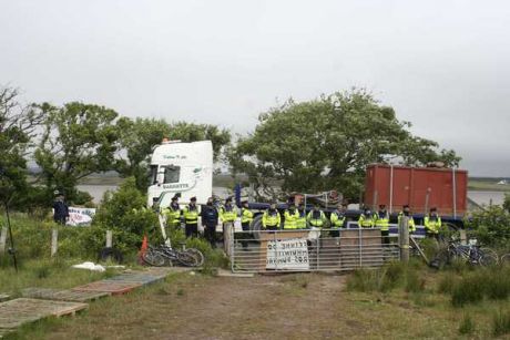 Click on image to see full-sized version Cops blocking the gate to the camp