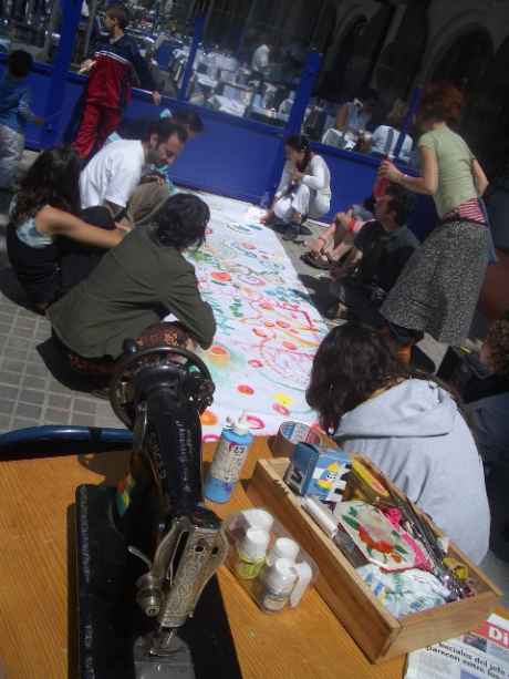 local kids from Barceloneta get their hands dirty to help resist the eviction of THEIR social centre