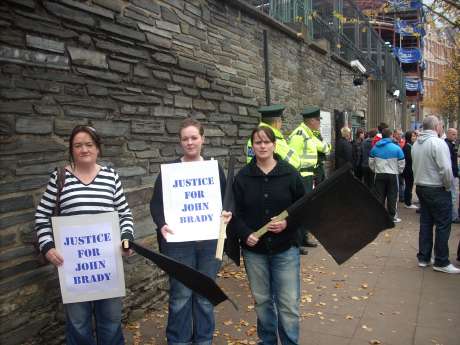 Protesters outside Strand Road PSNI station. The picket ran from Lawrence Hill to Clarendon Street