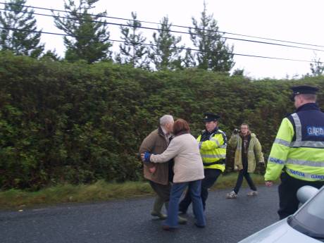 Proters being pushed and pulled around by Garda